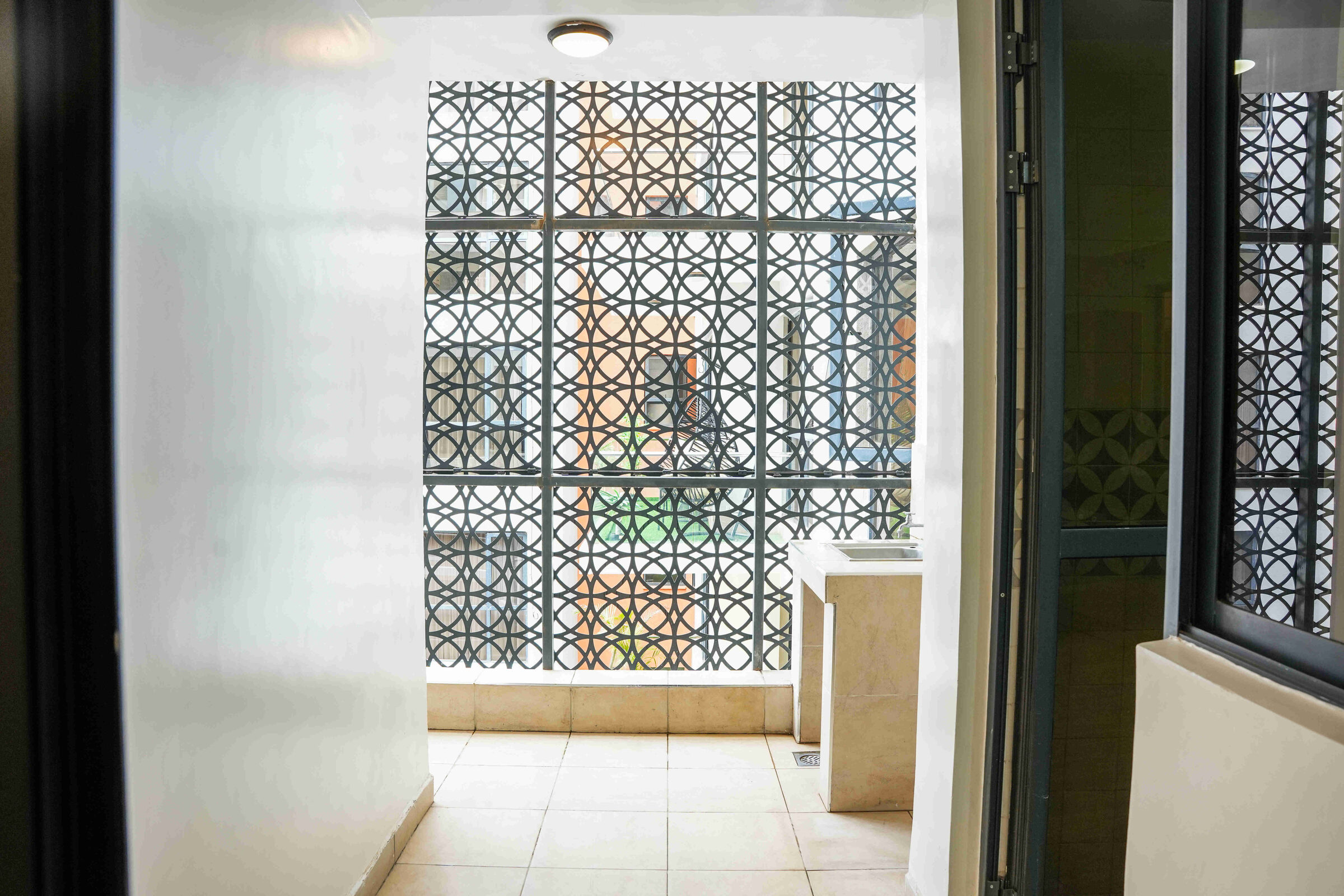 DSQ utility balcony with ornamental lattice grille at 5th Park Heights